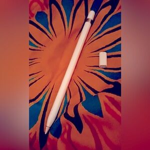 Apple IPad pen, with connector to charge it as well as cap when it is charged.